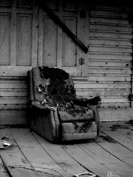 This chair was sitting on the porch of the abandoned train depot in Lettsworth, LA. Shot with my Canon S200.