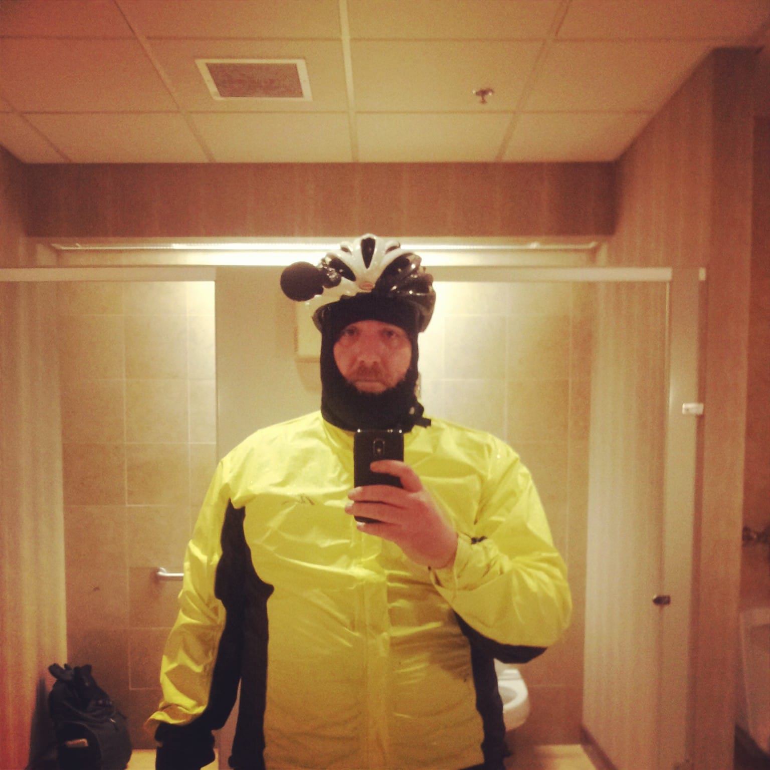 Color photo of myself decked out in rain gear getting ready for the ride.