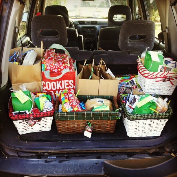 Color photo of gifts loaded into the back of a car.
