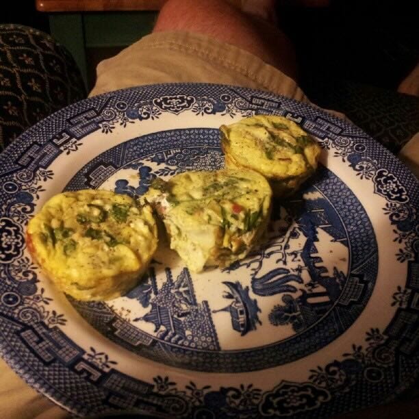 Color photo of mini frittatas on a plate.