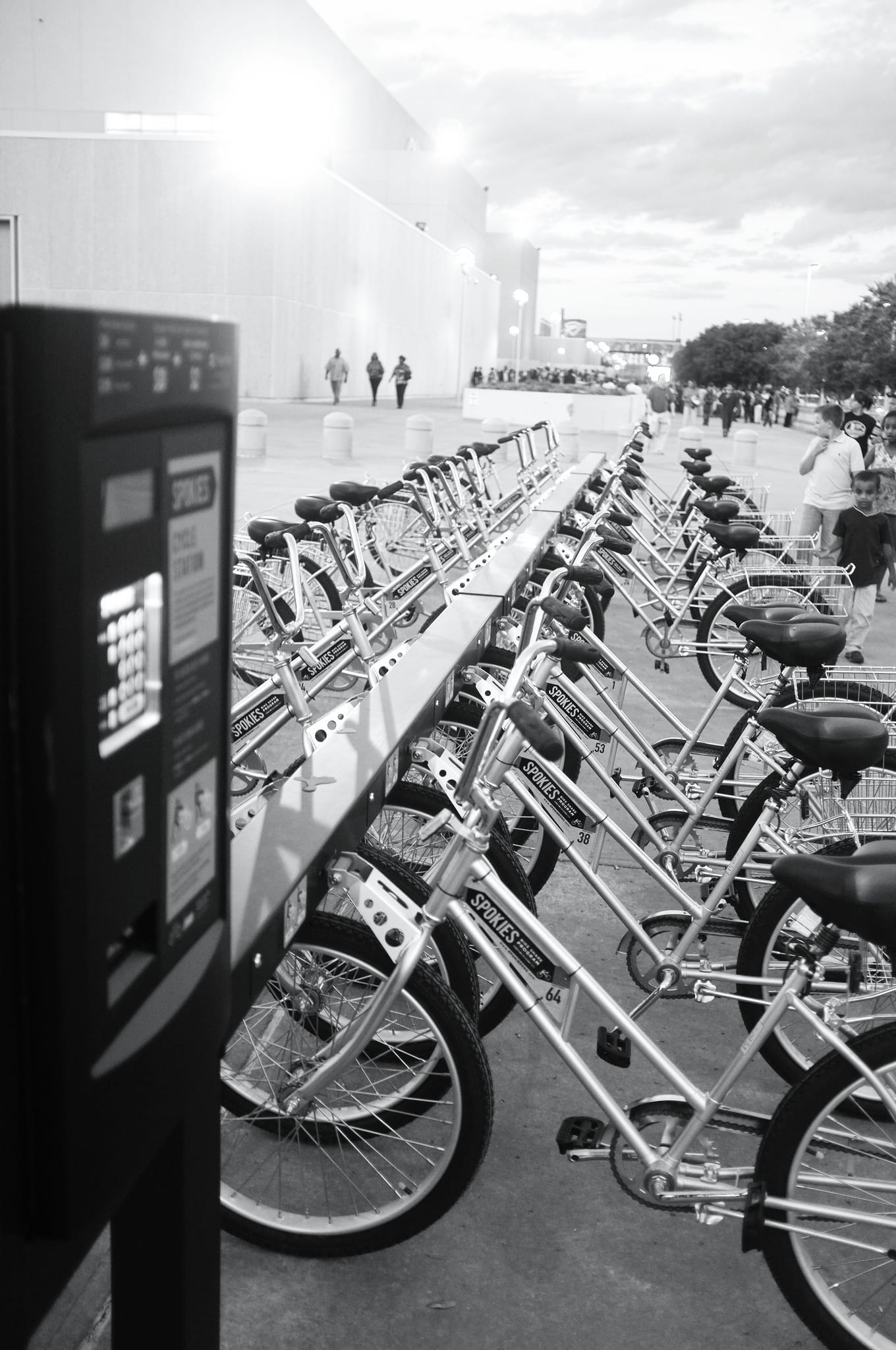 B&W photos of Spokies bikes in their racks.