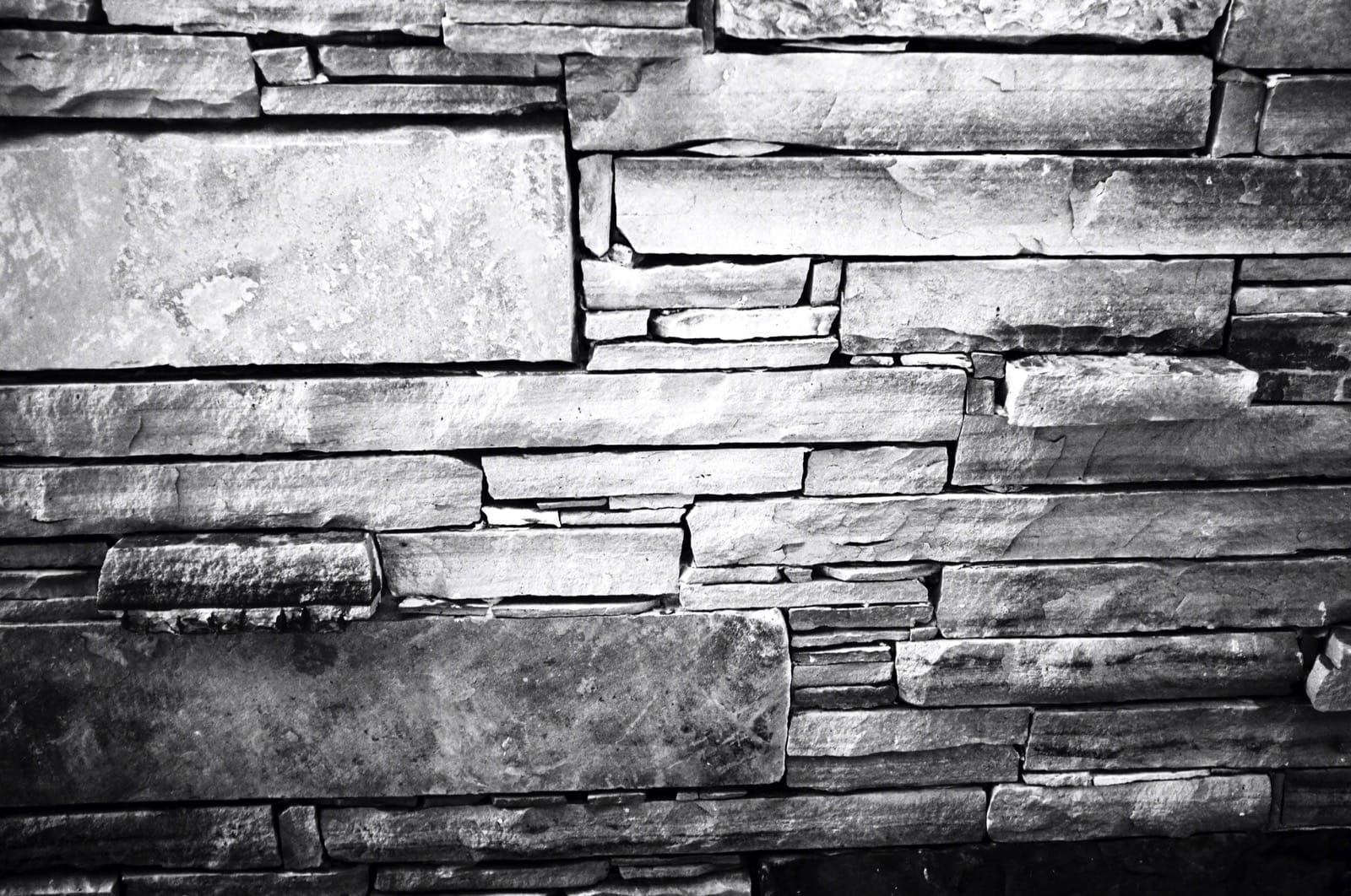 B&W photo of a decorative stone wall.