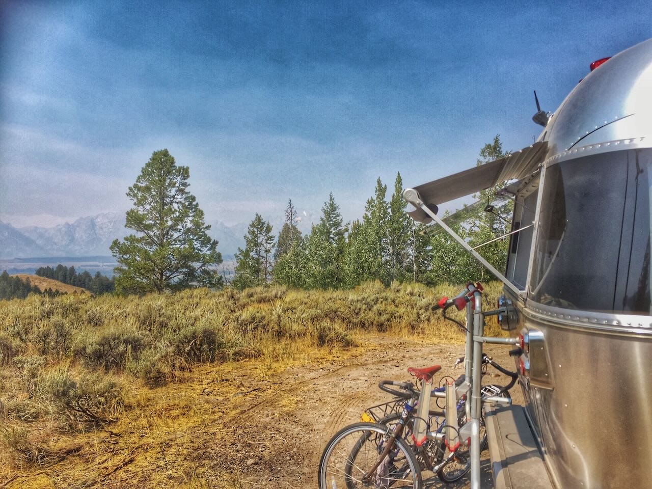 Airstream trailer looking over the Teton Mountains.